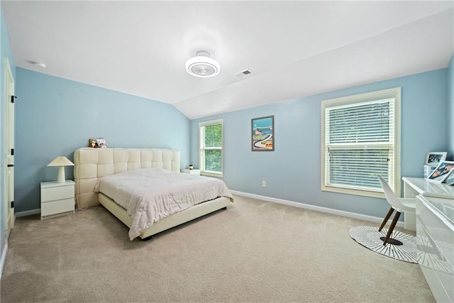 bedroom featuring carpet flooring, visible vents, baseboards, and vaulted ceiling