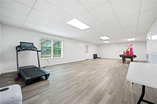 exercise area with a paneled ceiling, wood finished floors, baseboards, and billiards