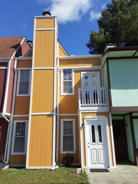 back of house with a balcony