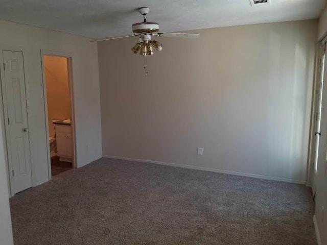 unfurnished room with baseboards, carpet flooring, and ceiling fan
