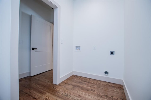 laundry room featuring hookup for a washing machine, hookup for an electric dryer, wood finished floors, laundry area, and baseboards