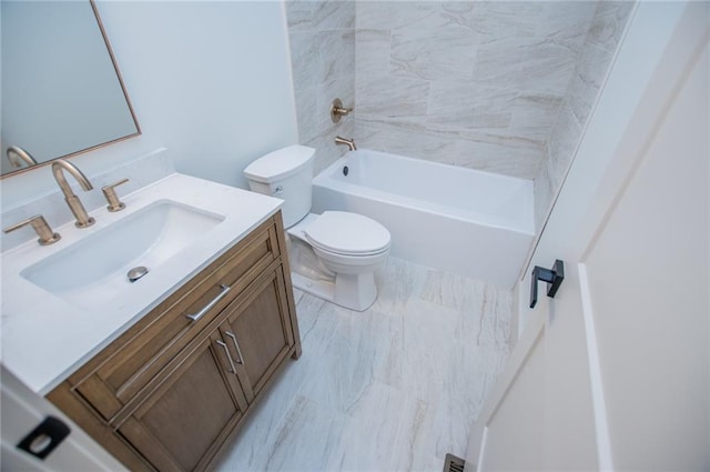 full bathroom featuring tub / shower combination, vanity, and toilet