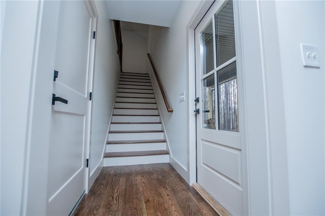 stairs with baseboards and wood finished floors