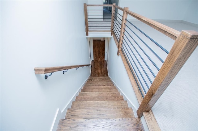 stairs featuring baseboards