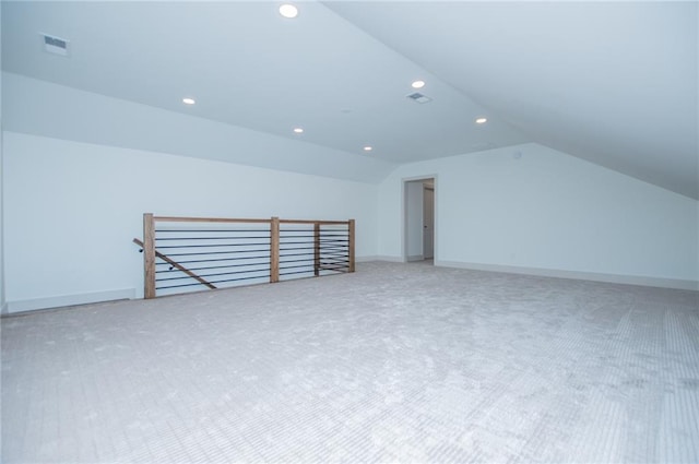 bonus room featuring vaulted ceiling, visible vents, and baseboards