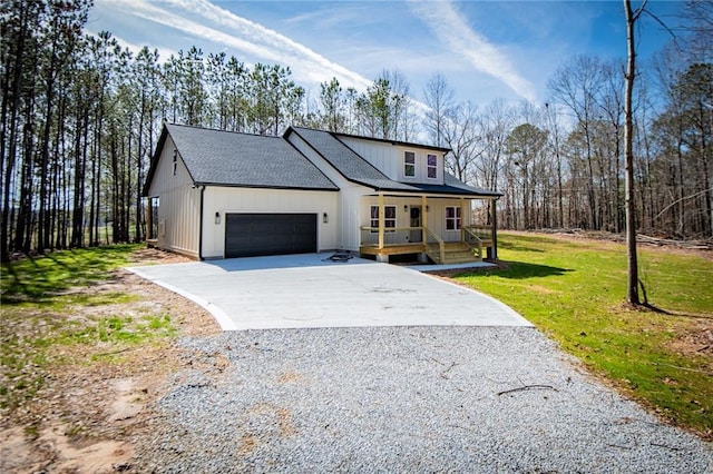 modern inspired farmhouse with roof with shingles, a porch, concrete driveway, an attached garage, and a front yard