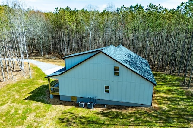 exterior space featuring a forest view