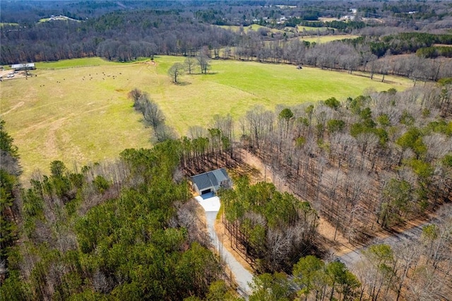 birds eye view of property with a rural view