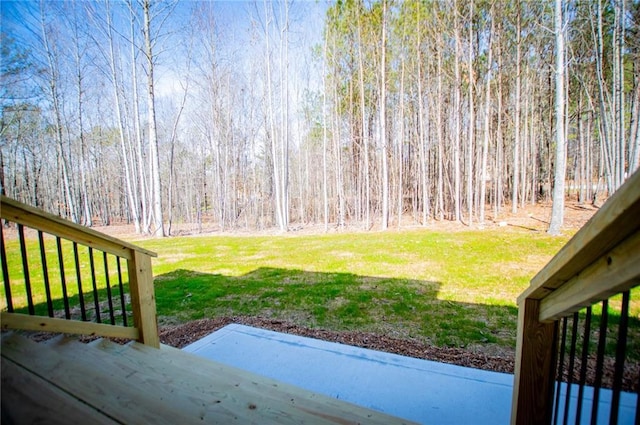 view of yard with a wooded view