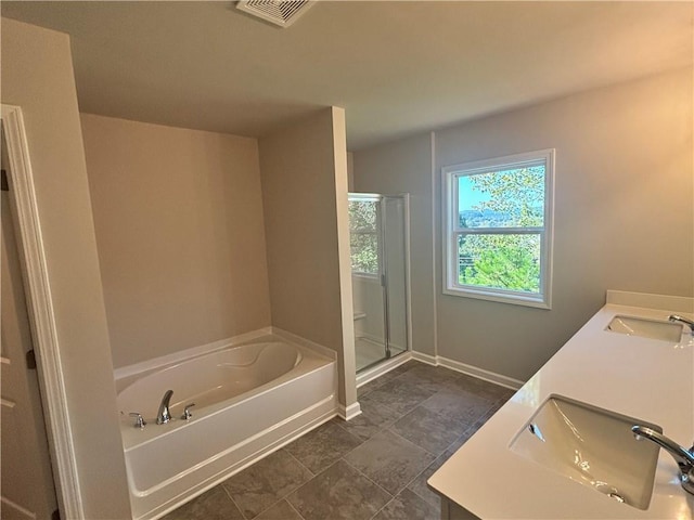 bathroom featuring vanity and plus walk in shower