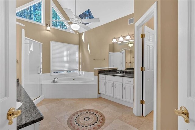 bathroom with tile patterned flooring, vanity, separate shower and tub, and ceiling fan