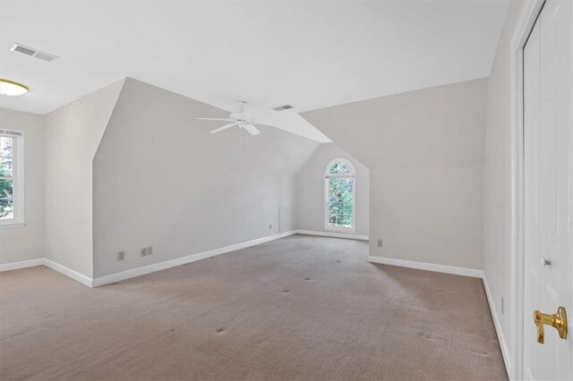 bonus room with carpet, ceiling fan, and lofted ceiling