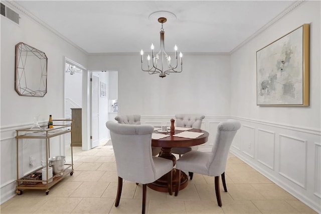 dining room featuring light tile patterned floors, visible vents, a notable chandelier, and crown molding