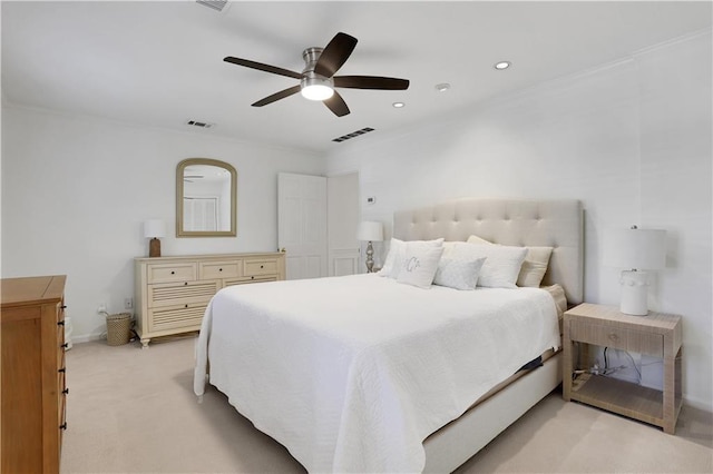 bedroom with visible vents, light colored carpet, crown molding, and a ceiling fan