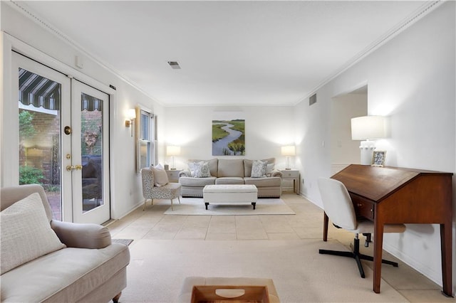 living area with french doors, visible vents, and ornamental molding