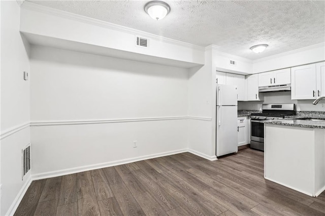 1931 Brian Way, Decatur, GA 30033 - kitchen featuring freestanding refrigerator, gas range, under cabinet range hood, dark wood-type flooring, and ornamental molding