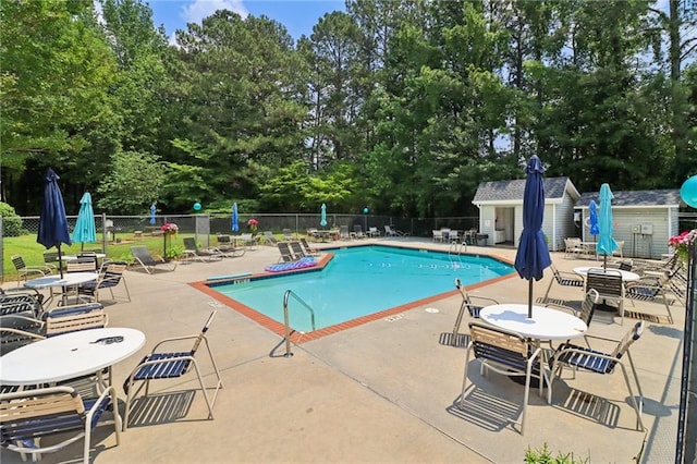 1931 Brian Way, Decatur, GA 30033 - community pool featuring a patio area, view of wooded area, and an outdoor structure