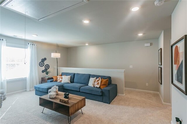 living area featuring attic access, recessed lighting, light colored carpet, and baseboards