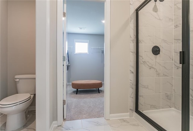 bathroom featuring a stall shower, marble finish floor, visible vents, and toilet