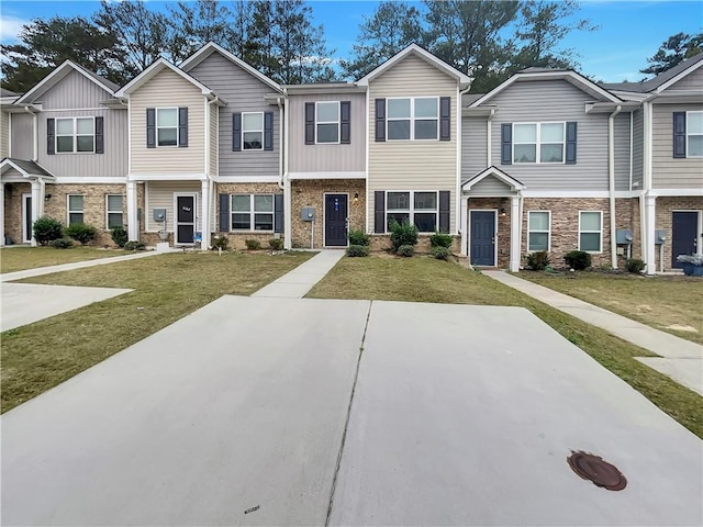 6077 Oakley Rd, Union City, GA 30291 - townhome / multi-family property with a front lawn