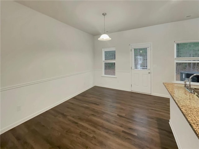 6077 Oakley Rd, Union City, GA 30291 - unfurnished dining area with dark hardwood / wood-style floors and sink