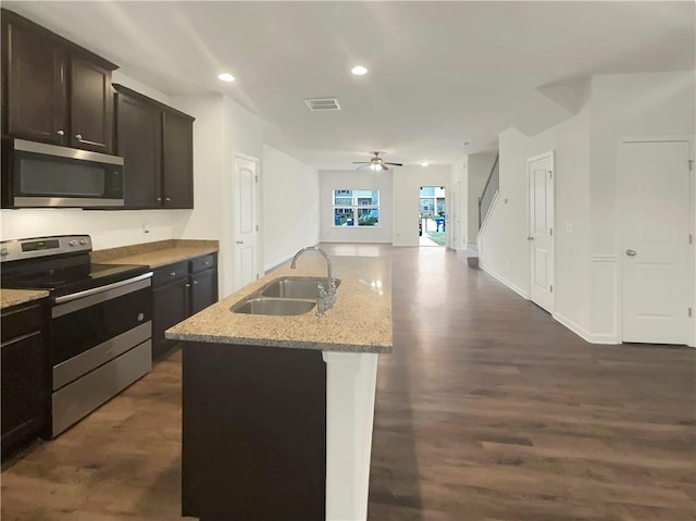 6077 Oakley Rd, Union City, GA 30291 - kitchen featuring sink, a kitchen island with sink, ceiling fan, stainless steel appliances, and dark wood-type flooring