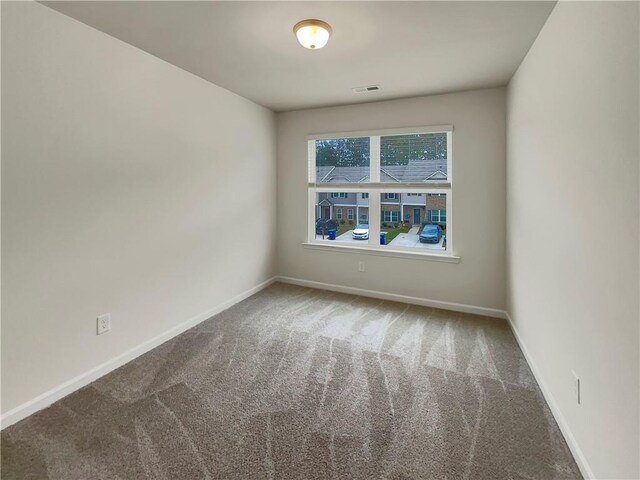 6077 Oakley Rd, Union City, GA 30291 - view of carpeted spare room