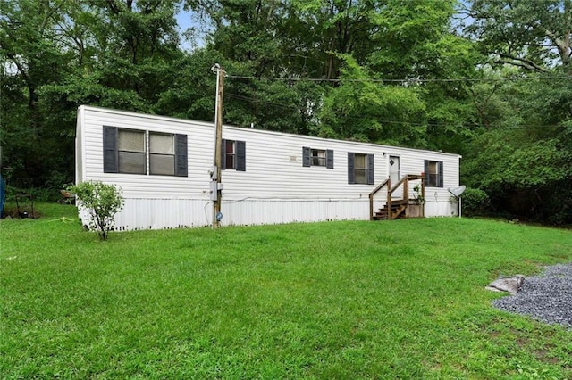 manufactured / mobile home with a front lawn