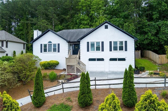 2111 Yorkshire Ct, Woodstock, GA 30189 - ranch-style home featuring stucco siding, concrete driveway, a chimney, and an attached garage