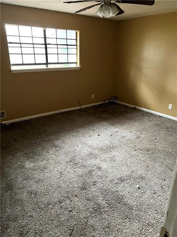 6354 Shannon Pkwy Unit 30D, Union City, GA 30291 - carpeted spare room with ceiling fan and a textured ceiling