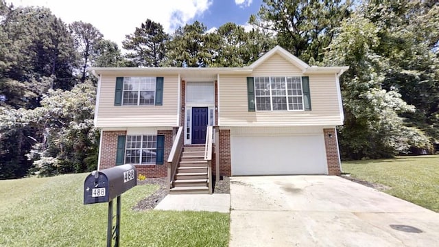 488 Barclay Ct, Stone Mountain, GA 30083 - raised ranch featuring brick siding, a garage, concrete driveway, and a front yard