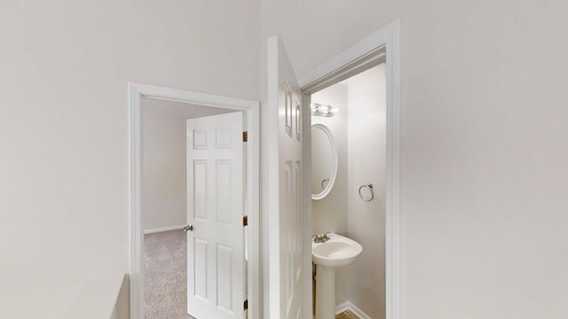 488 Barclay Ct, Stone Mountain, GA 30083 - bathroom with baseboards and a sink
