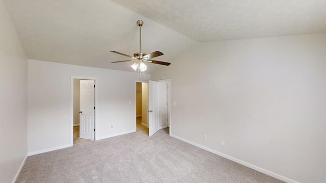 488 Barclay Ct, Stone Mountain, GA 30083 - unfurnished bedroom with lofted ceiling, light colored carpet, and a ceiling fan