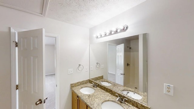 488 Barclay Ct, Stone Mountain, GA 30083 - bathroom with double vanity, a shower, and a textured ceiling