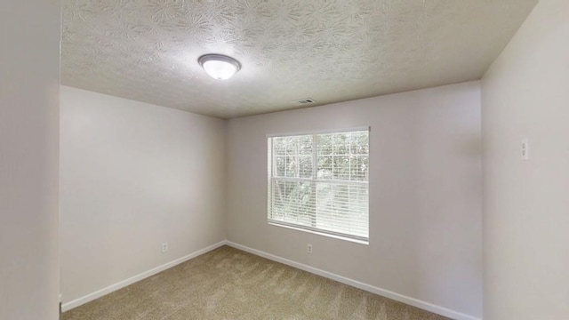 488 Barclay Ct, Stone Mountain, GA 30083 - empty room with light colored carpet and a textured ceiling
