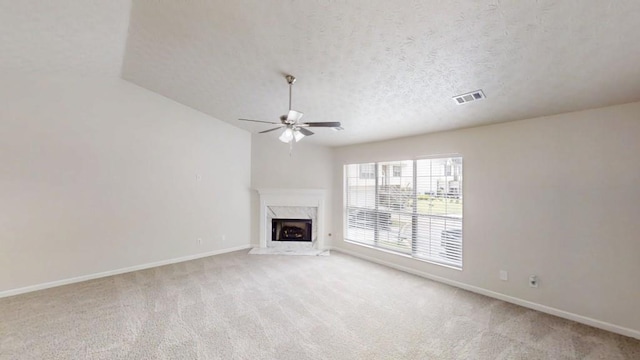 488 Barclay Ct, Stone Mountain, GA 30083 - unfurnished living room featuring ceiling fan, a premium fireplace, light carpet, and a textured ceiling