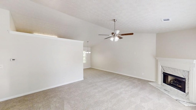 488 Barclay Ct, Stone Mountain, GA 30083 - unfurnished living room featuring a ceiling fan, carpet flooring, a high end fireplace, and lofted ceiling