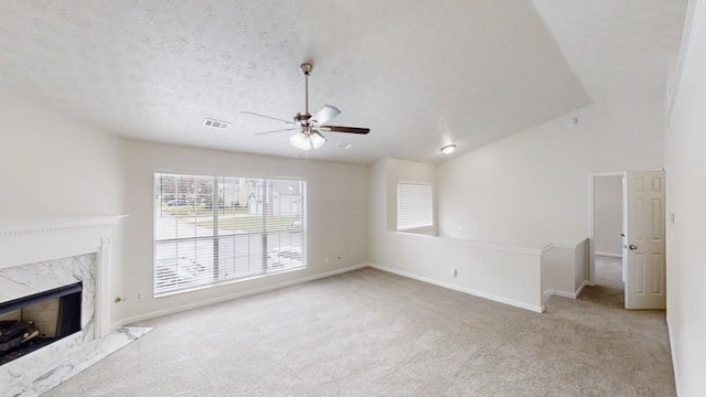488 Barclay Ct, Stone Mountain, GA 30083 - unfurnished living room with a ceiling fan, carpet floors, a fireplace, and vaulted ceiling