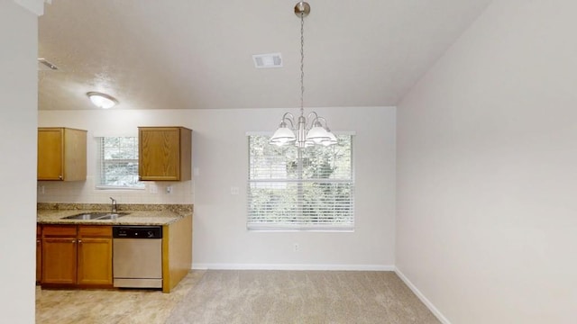 488 Barclay Ct, Stone Mountain, GA 30083 - kitchen with stainless steel dishwasher, a chandelier, tasteful backsplash, brown cabinets, and light stone countertops