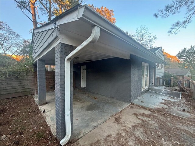 view of side of property featuring a patio area