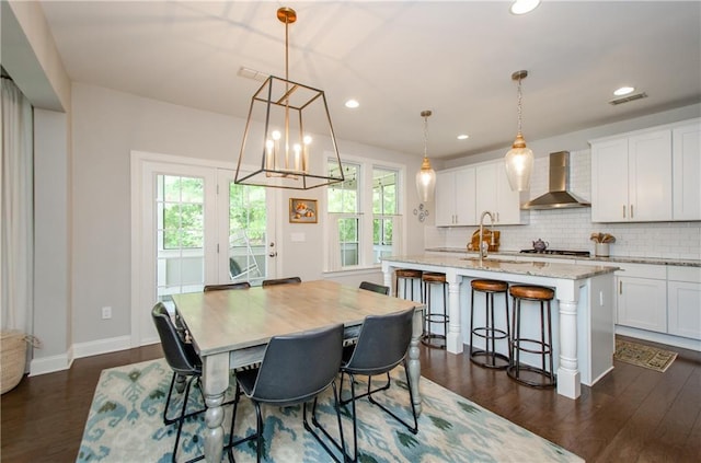 2535 Castlerock Ct, Cumming, GA 30041 - dining room featuring dark wood-style flooring, a chandelier, and recessed lighting
