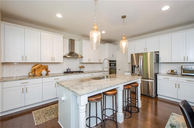 2535 Castlerock Ct, Cumming, GA 30041 - kitchen featuring wall chimney range hood, stainless steel appliances, backsplash, white cabinetry, and recessed lighting