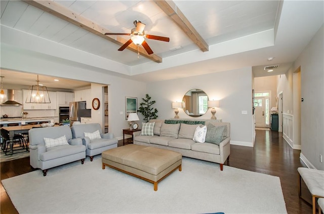 2535 Castlerock Ct, Cumming, GA 30041 - living area with dark wood-type flooring, a ceiling fan, and beamed ceiling