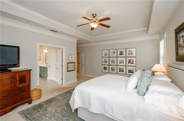 2535 Castlerock Ct, Cumming, GA 30041 - bedroom featuring a tray ceiling, light carpet, connected bathroom, ornamental molding, and a ceiling fan