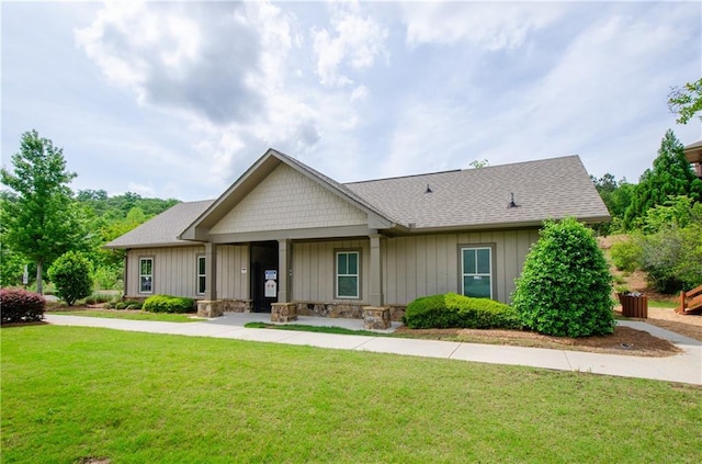 2535 Castlerock Ct, Cumming, GA 30041 - craftsman house featuring a front lawn, board and batten siding, and roof with shingles