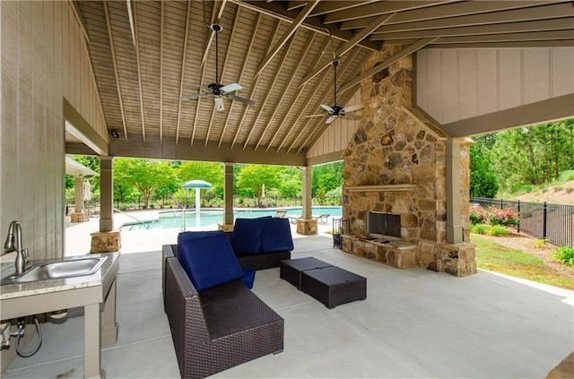 2535 Castlerock Ct, Cumming, GA 30041 - view of patio with a ceiling fan and an outdoor living space with a fireplace