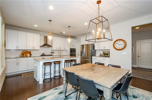2535 Castlerock Ct, Cumming, GA 30041 - dining room featuring recessed lighting, dark wood-style floors, and a chandelier