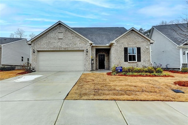 ranch-style house with a garage, concrete driveway, and brick siding