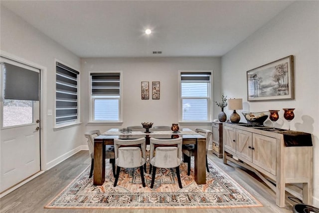 811 Pineberry Ct, Grayson, GA 30017 - dining room with healthy amount of natural light, light wood finished floors, and baseboards