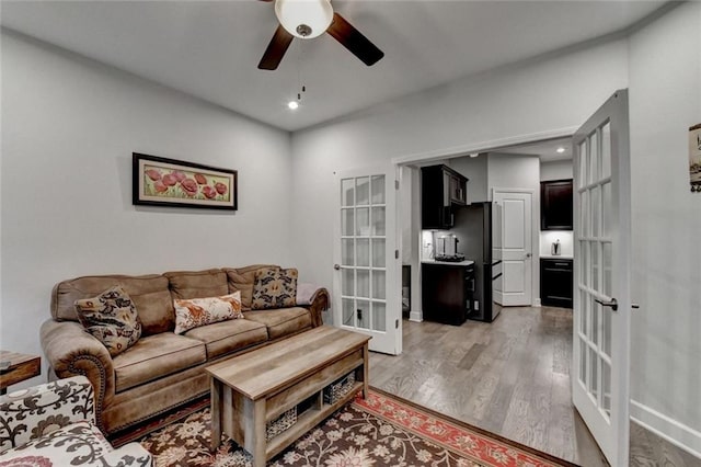 living room featuring french doors, recessed lighting, light wood-style flooring, and a ceiling fan